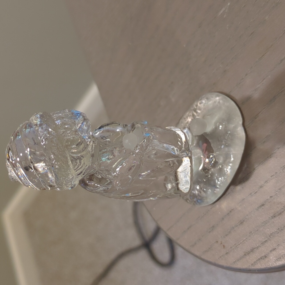 Figurine of little girl holding bird in winter